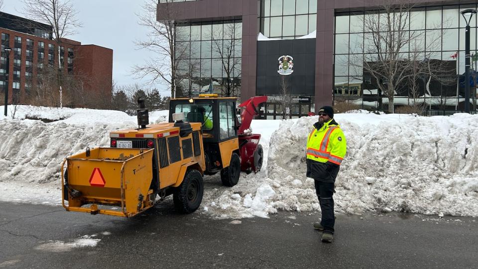 Crews clear the main entrance to the Civic Centre in Sydney after record snowfall in early February.