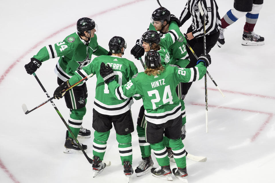 Dallas Stars players celebrate a goal against the Colorado Avalanche during first-period NHL Western Conference Stanley Cup playoff action in Edmonton, Alberta, Sunday, Aug. 30, 2020. (Jason Franson/The Canadian Press via AP)