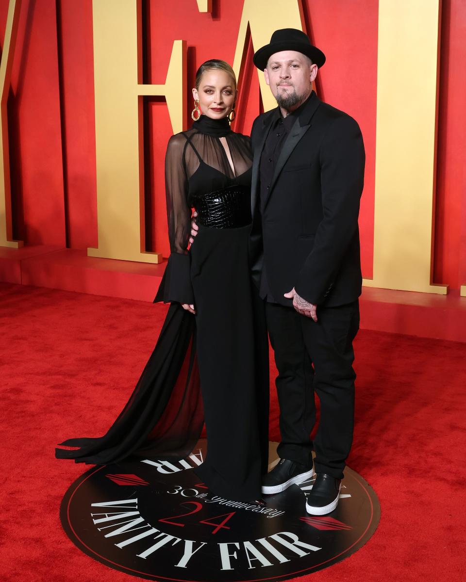 Image may contain: Joel Madden, Nicole Richie, Fashion, Clothing, Footwear, Shoe, Hat, Adult, and Person