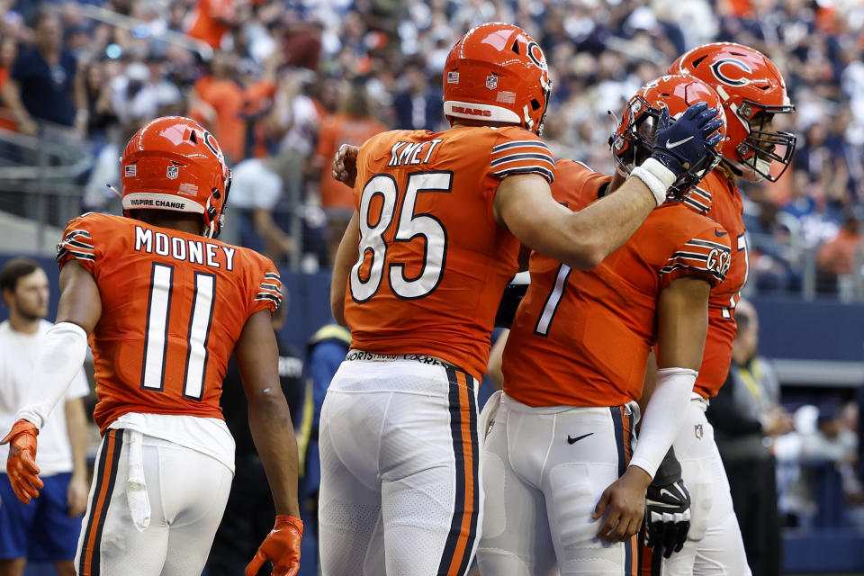 ARLINGTON, TEXAS – OCTOBER 30: Cole Kmet #85 of the Chicago Bears is congratulated by Justin Fields #1 of the Chicago Bears after catching a touchdown pass against the <a class="link " href="https://sports.yahoo.com/nfl/teams/dallas/" data-i13n="sec:content-canvas;subsec:anchor_text;elm:context_link" data-ylk="slk:Dallas Cowboys;sec:content-canvas;subsec:anchor_text;elm:context_link;itc:0">Dallas Cowboys</a> during the fourth quarter at AT&T Stadium on October 30, 2022 in Arlington, Texas. (Photo by Wesley Hitt/Getty Images)