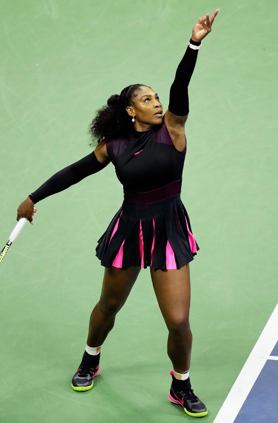 Serena Williams of the United States serves to Ekaterina Makarova of Russia during her first round Women's Singles match on Day Two of the 2016 US Open at the USTA Billie Jean King National Tennis Center on August 30, 2016 in the Flushing neighborhood of the Queens borough of New York City