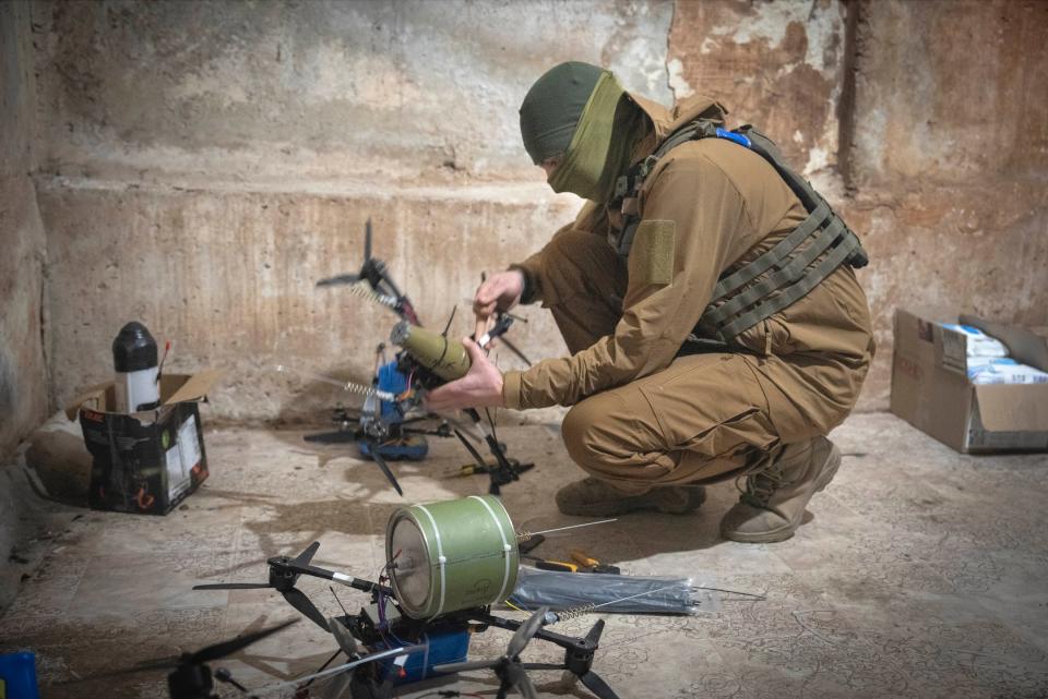 A Ukrainian soldier of the 71st Jaeger Brigade prepares FPV drones at the frontline near Avdiivka, in the Donetsk region, on March 22, 2024.