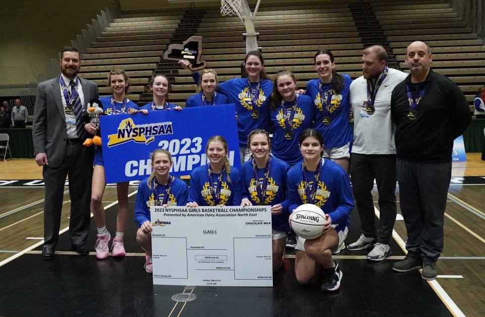 Millbrook celebrates their 59-45 win over Randolph to claim the girls NYSPHSAA Class C championship title at Hudson Valley Community College in Troy, on Sunday, March 19, 2023.