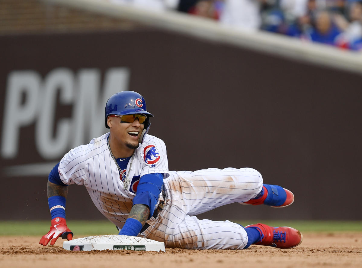 Cubs SS Javy Baez tosses bat past mound on strikeout, sails throw over  first base into stands