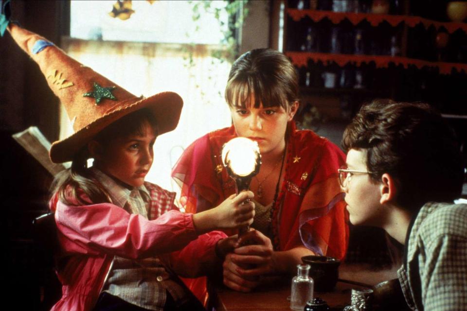<p>AJ Pics/Alamy</p> Emily Roeske, Kimberly J. Brown and Joey Zimmerman in "Halloweentown" (1998).