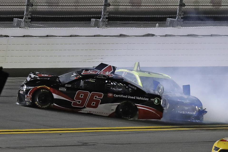 Daniel Suarez (96) and Ryan Blaney (12) crash into each other during a NASCAR Daytona 500 qualifying auto race Thursday, Feb. 13, 2020, at Daytona International Speedway in Daytona Beach, Fla. (AP Photo/Chris O'Meara)