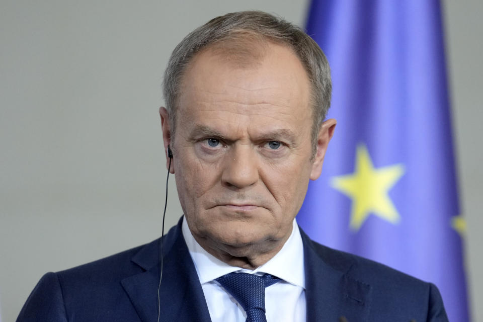 Poland's Prime Minister Donald Tusk listens to the media in Berlin, Germany, Friday, March 15, 2024. German Chancellor Olaf Scholz, France's President Emmanuel Macron and Poland's Prime Minister Donald Tusk meet in Berlin for the so-called Weimar Triangle talks. (AP Photo/Ebrahim Noroozi)