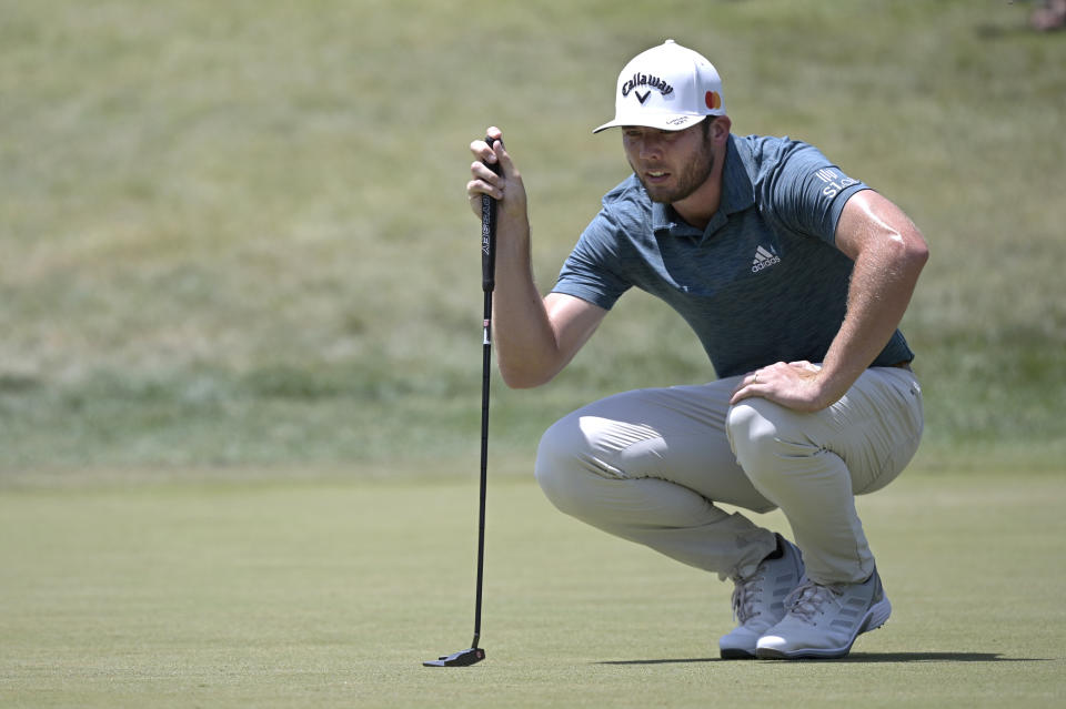 Sam Burns lines up a putt on the first green during the final round of the Valspar Championship golf tournament, Sunday, May 2, 2021, in Palm Harbor, Fla. (AP Photo/Phelan M. Ebenhack)