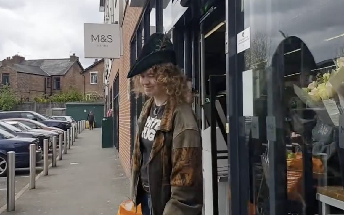 An Everybody Eats activist outside a branch of M&S