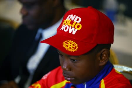 A boy wears a cap during a news conference marking the 3-year-polio-free milestone in Abuja