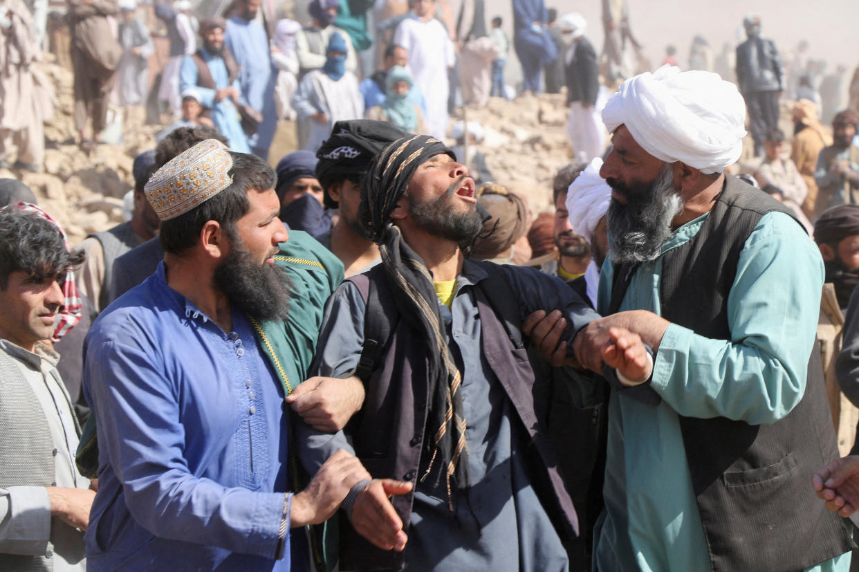 People gather in the aftermath of an earthquake.