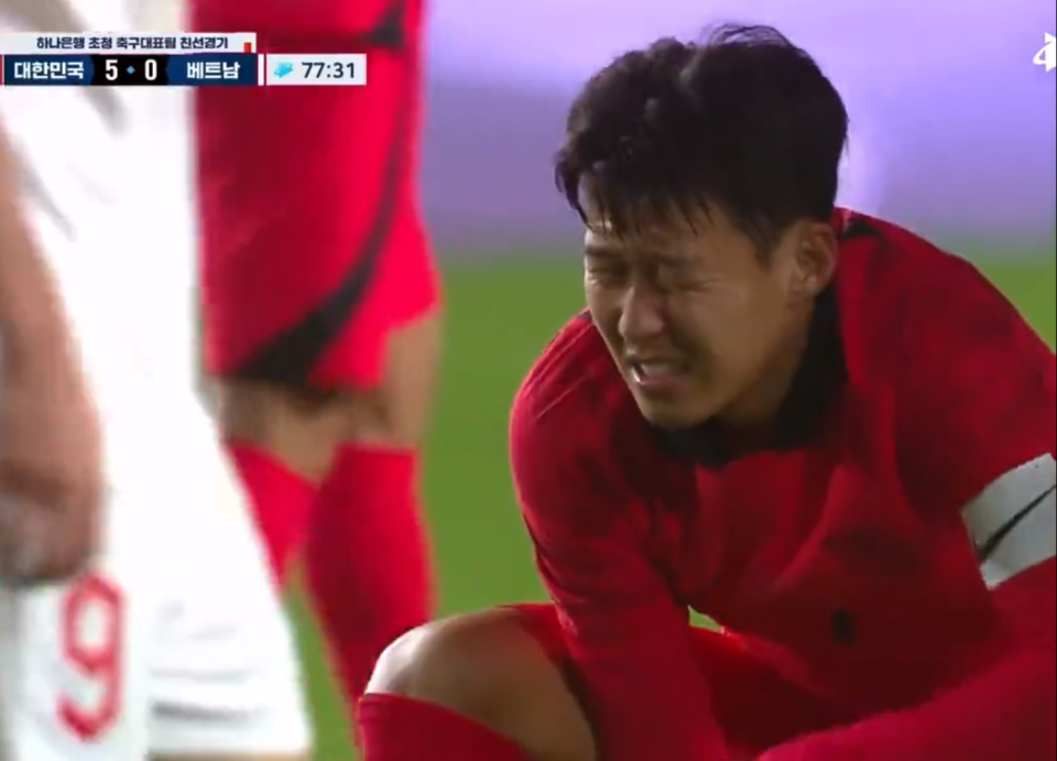 Pain: Heung-min Son was seen grimacing while playing for South Korea (Twitter)