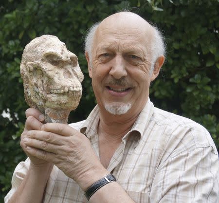 Ron Clarke, a professor in the Evolutionary Studies Institute at Wits University in South Africa holds the Little Foot skull in this undated handout photo obtained by Reuters April 1, 2015. REUTERS/Wits University/Handout via Reuters