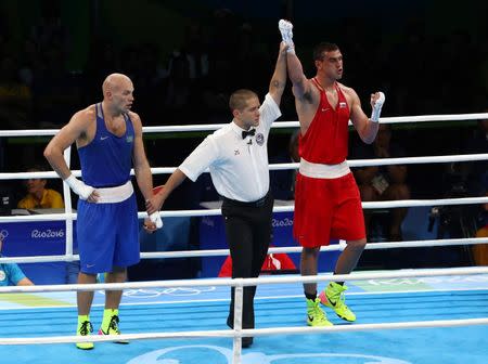 2016 Rio Olympics - Boxing - Final - Men's Heavy (91kg) Final Bout 220 - Riocentro - Pavilion 6 - Rio de Janeiro, Brazil - 15/08/2016. Evgeny Tishchenko (RUS) of Russia celebrates after winning his bout against Vassiliy Levit (KAZ) of Kazakhstan. REUTERS/Yves Herman