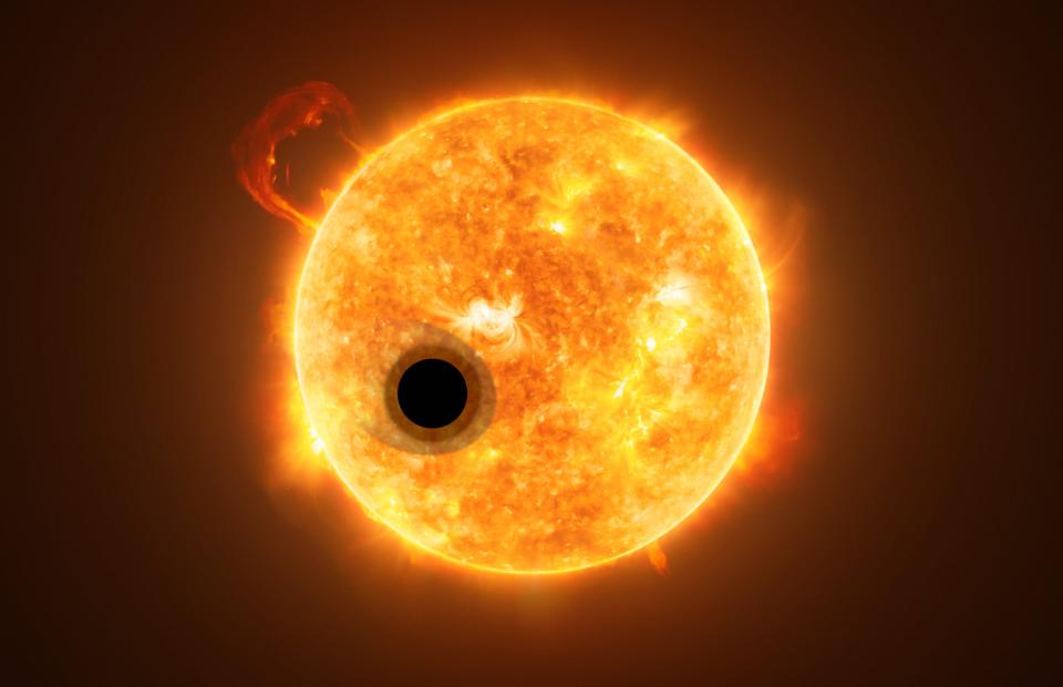 Artist's impression of a planet passing in front of its host star in a coronal mass ejection.