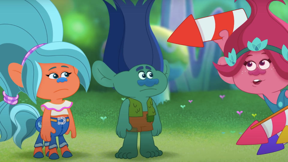 Poppy shows fireworks to her fellow trolls in Trolls TrollsTopia.