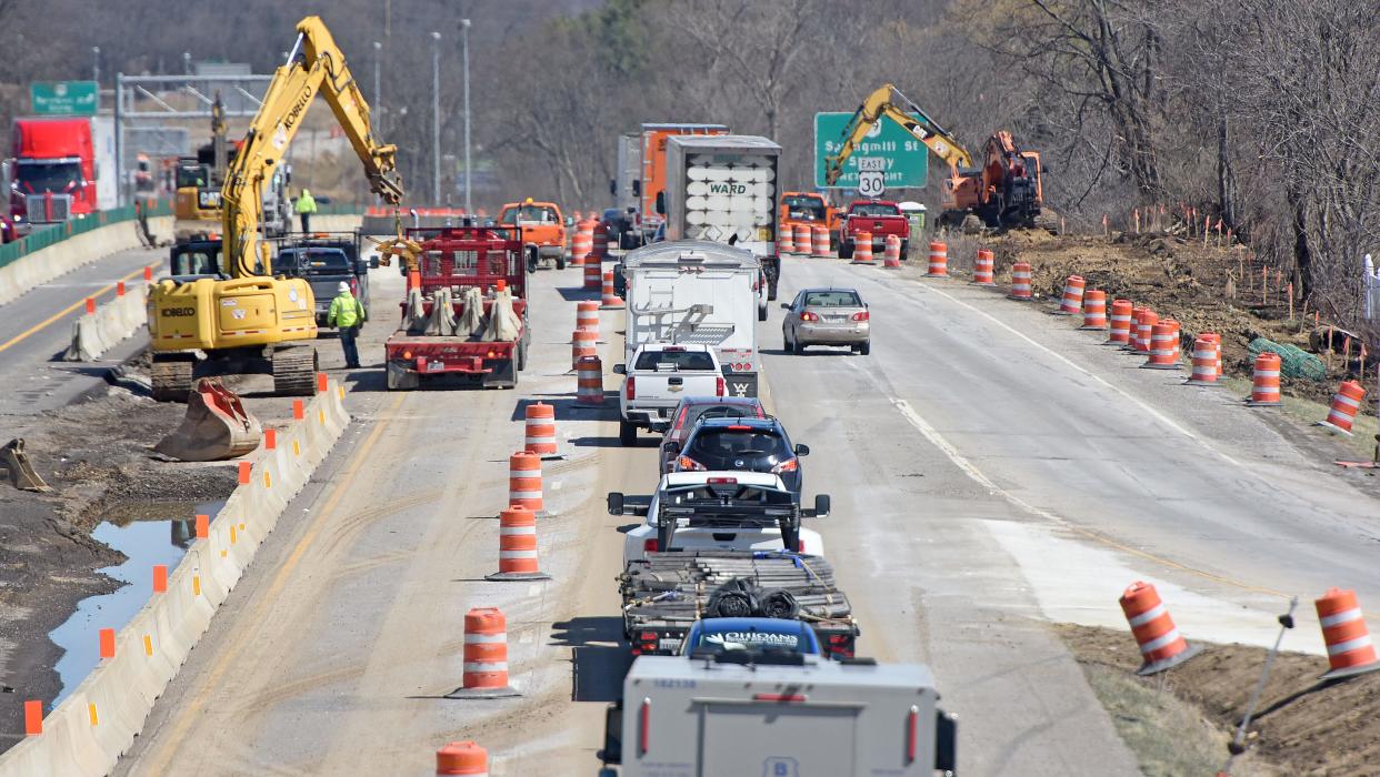 Traffic slows east of the Trimble Road exit Tuesday afternoon as off ramp traffic merges with a single lane on US 30 as construction continues.