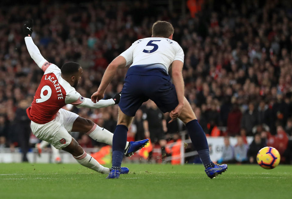 Arsenal’s Alexandre Lacazette (left) scores his side’s third goal of the game