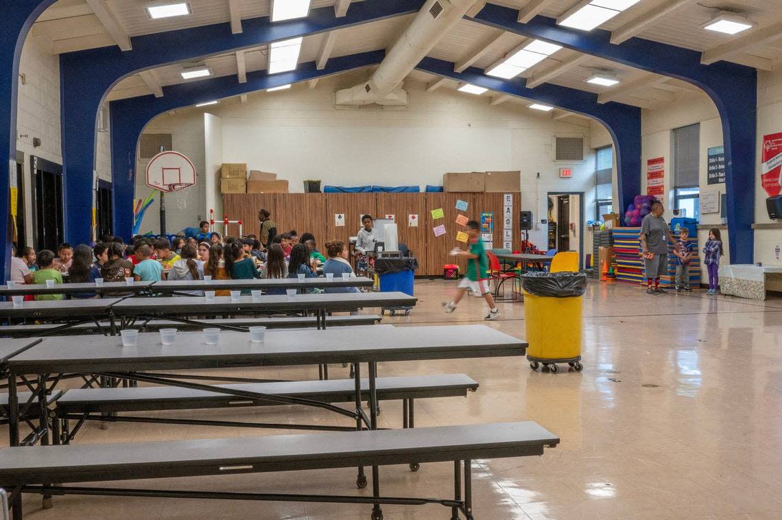 Students dine in the multi-purpose cafeteria, which doubles as a gymnasium, at Eugene Ware Elementary School on Tuesday, April 16, 2024, in Kansas City, Kansas. Emily Curiel/ecuriel@kcstar.com