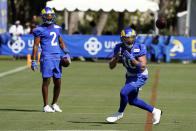 Los Angeles Rams wide receiver Cooper Kupp, right, makes a catch in front of wide receiver Robert Woods (2) during practice at the NFL football team's training camp Wednesday, July 28, 2021, in Irvine, Calif. (AP Photo/Marcio Jose Sanchez)