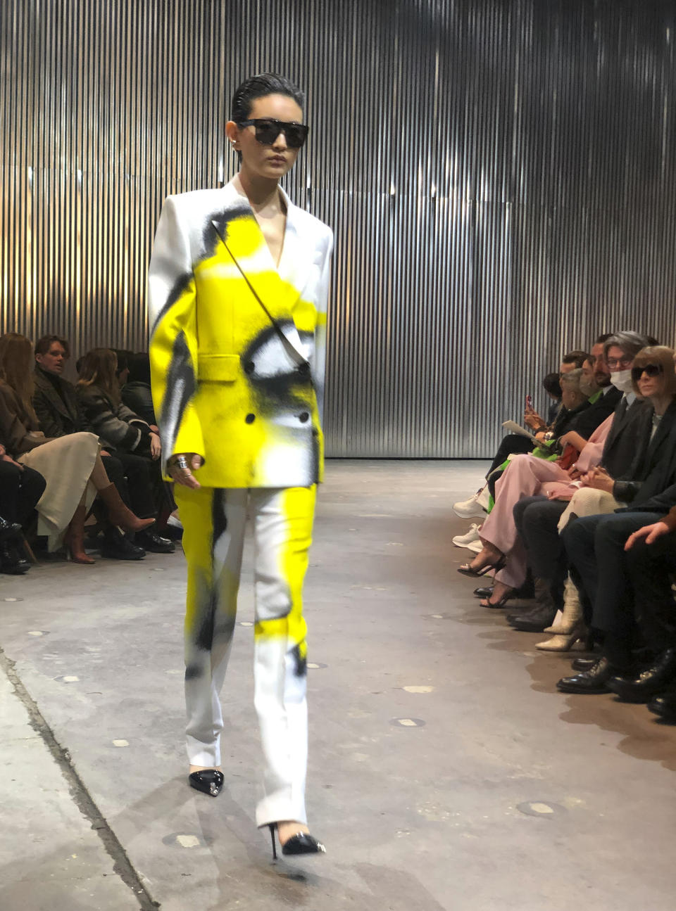 A model walks the runway wearing fashion from the Alexander McQueen Autumn/Winter 2022 collection on Tuesday, March 15, 2022 in New York. (AP Photo/Leanne Italie)