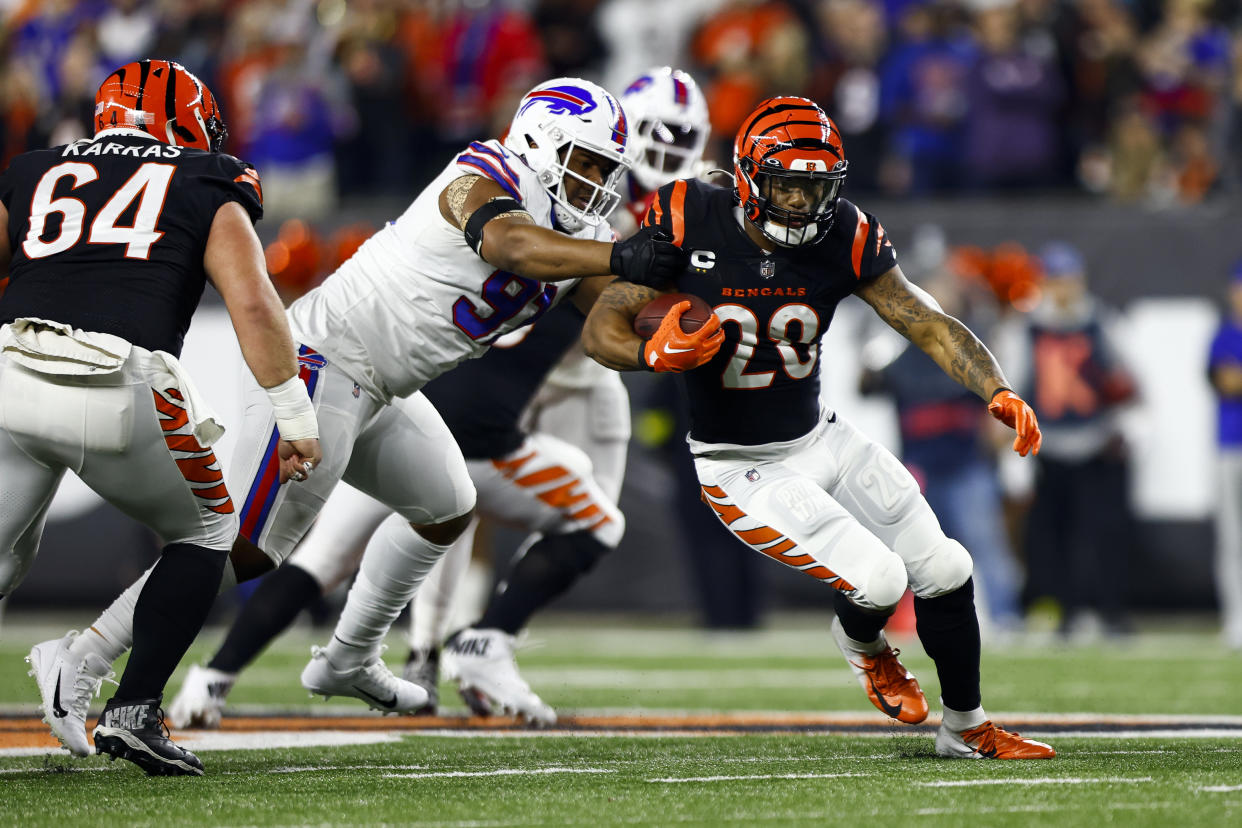CINCINNATI, OH - JANUARY 2: Joe Mixon #28 of the Cincinnati Bengals carries the ball during an NFL football game against the Buffalo Bills at Paycor Stadium on January 2, 2023 in Cincinnati, Ohio. (Photo by Kevin Sabitus/Getty Images)