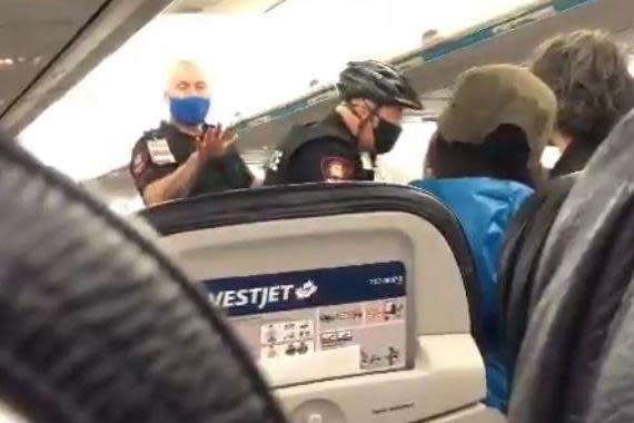 Police boarded the flight amid the mask dispute