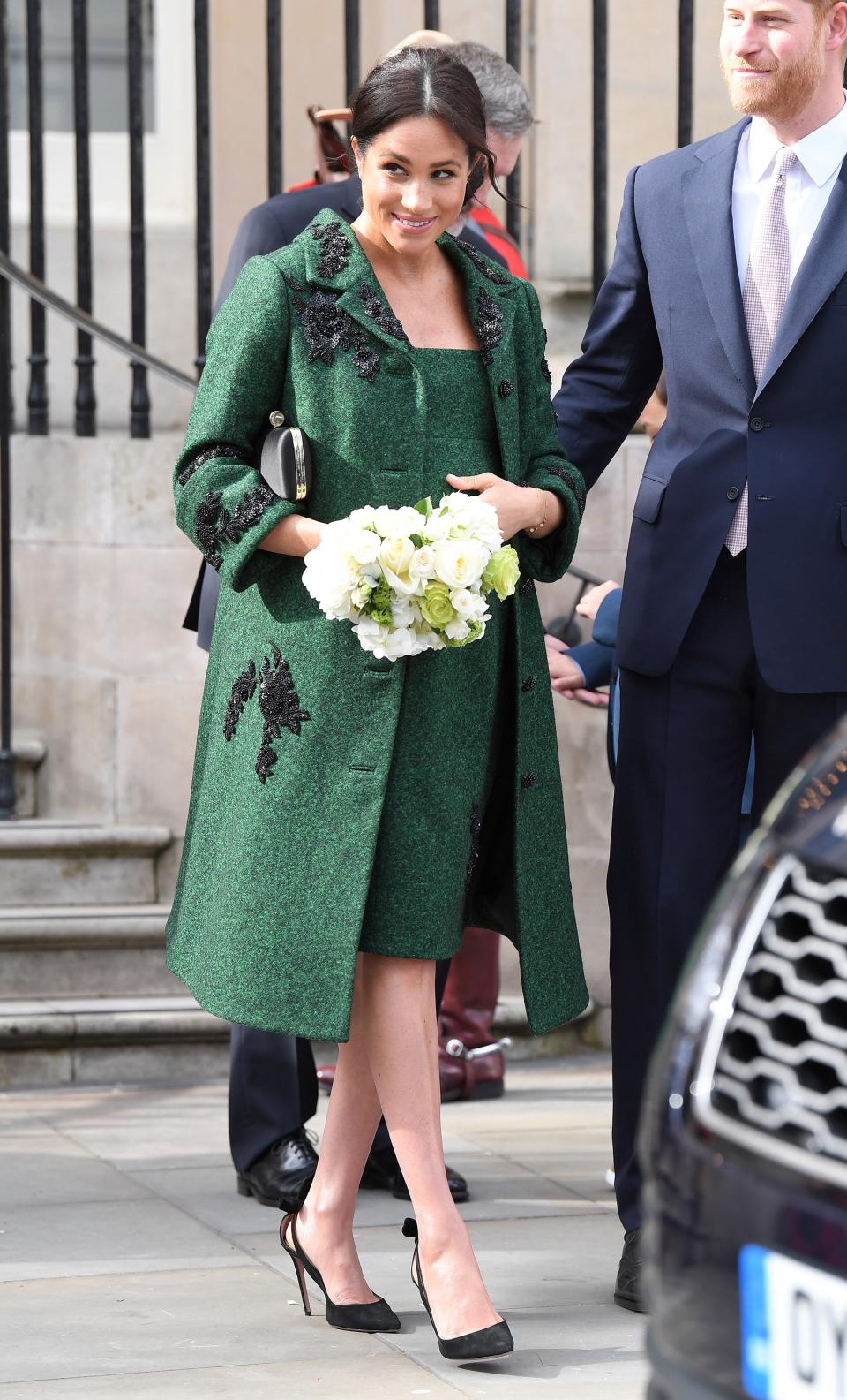 In one of her final public appearances before welcoming son Archie, Meghan celebrated Commonwealth Day at London's Canada House in a knee-length green jacket with delicate appliqué hugged her baby bump. The coat also had a fun connection to Meghan’s mom, <a href="https://people.com/tag/doria-ragland/" rel="nofollow noopener" target="_blank" data-ylk="slk:Doria Ragland;elm:context_link;itc:0;sec:content-canvas" class="link ">Doria Ragland</a>. According to designer Erdem, the black floral embellishments are known as the “Doria beaded rose embroidery.”