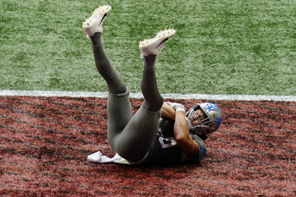 Detroit Lions tight end T.J. Hockenson (88) falls into the end zone for a touchdown against the Atlanta Falcons during the second half of an NFL football game, Sunday, Oct. 25, 2020, in Atlanta. The Detroit Lions won 23-22. (AP Photo/Brynn Anderson)