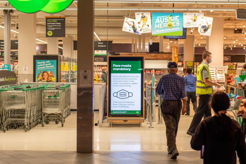 Sydney, Australia 2021-01-07: Exterior view of Woolworths Miranda supermarket during the COVID-19 pandemic lockdown. Face mask mandatory sign