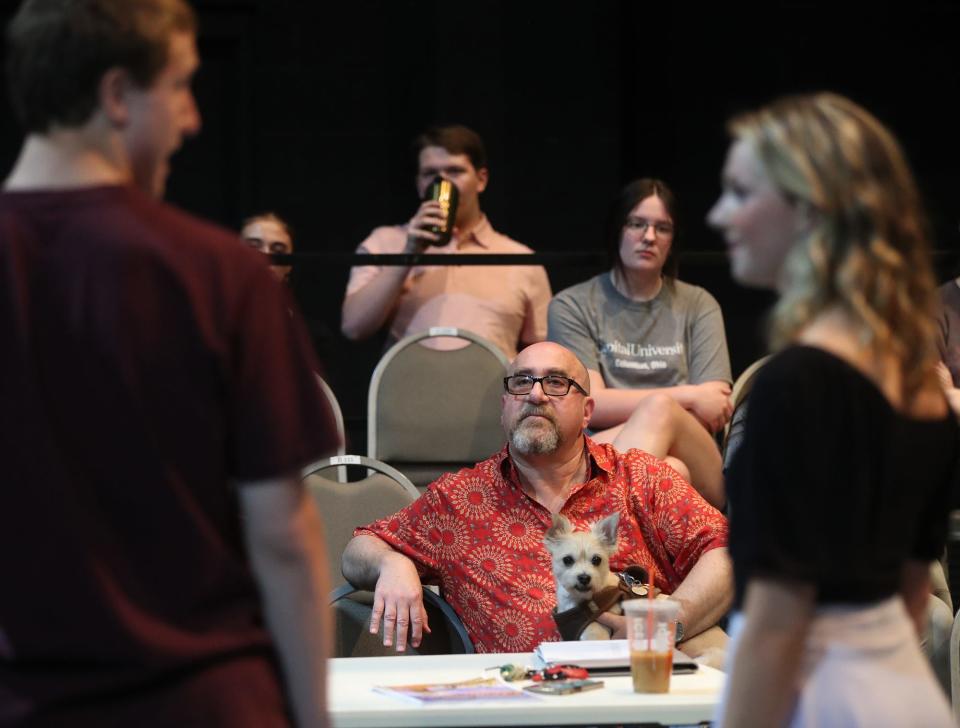 Stanley Niekamp and Leah Spacek rehearse as director Warren Scott Friedman and his dog, Beau, watch May 25 at Guzzetta Hall at the University of Akron's Sandefur Theatre.