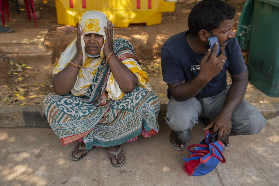 Jenima Mondal, left. whose son Mamjur Ali Mondal died in Friday's train accident mourns at the All India Institute of Medical Sciences hospital in Bhubaneswar in the eastern state of Orissa, India, Monday, June 5, 2023. Families of the victims of India's deadliest train crash in decades filled the hospital on Monday to identify and collect bodies of relatives, as railway officials recommended the country's premier criminal investigating agency to probe the crash that killed 275 people. (AP Photo/Rafiq Maqbool)