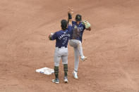 Tampa Bay Rays' Jose Caballero, left, and Richie Palacios celebrate their team's win over the Toronto Blue Jays following a baseball game, Saturday, May 18, 2024, in Toronto. (Chris Young/The Canadian Press via AP)