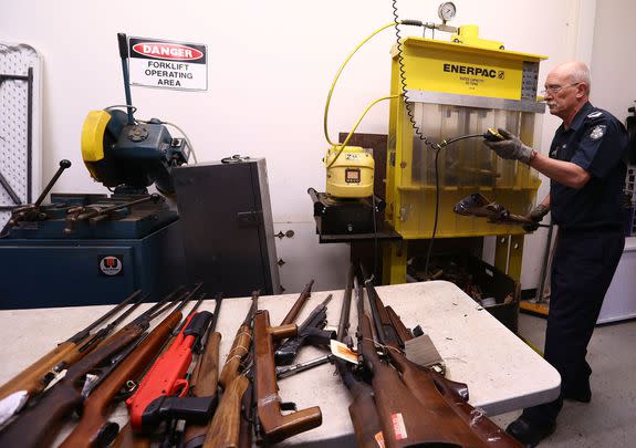 Leading Senior Constable Steve Batten destroys a rifle, at the Victoria Police Forensic Services Centre on Aug. 11, 2017 in Melbourne, Australia.