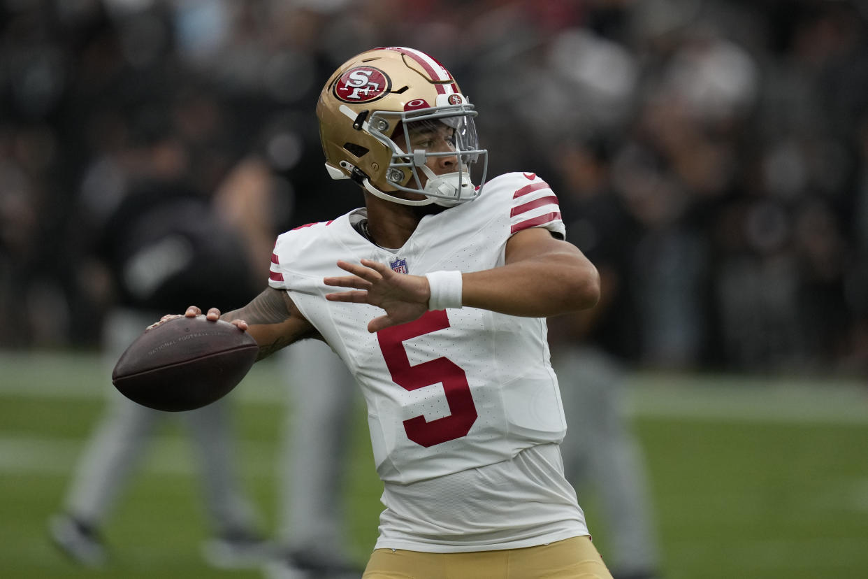 San Francisco 49ers quarterback Trey Lance (5) warms up before an NFL football game against the Las Vegas Raiders, Sunday, Aug. 13, 2023, in Las Vegas. (AP Photo/John Locher)