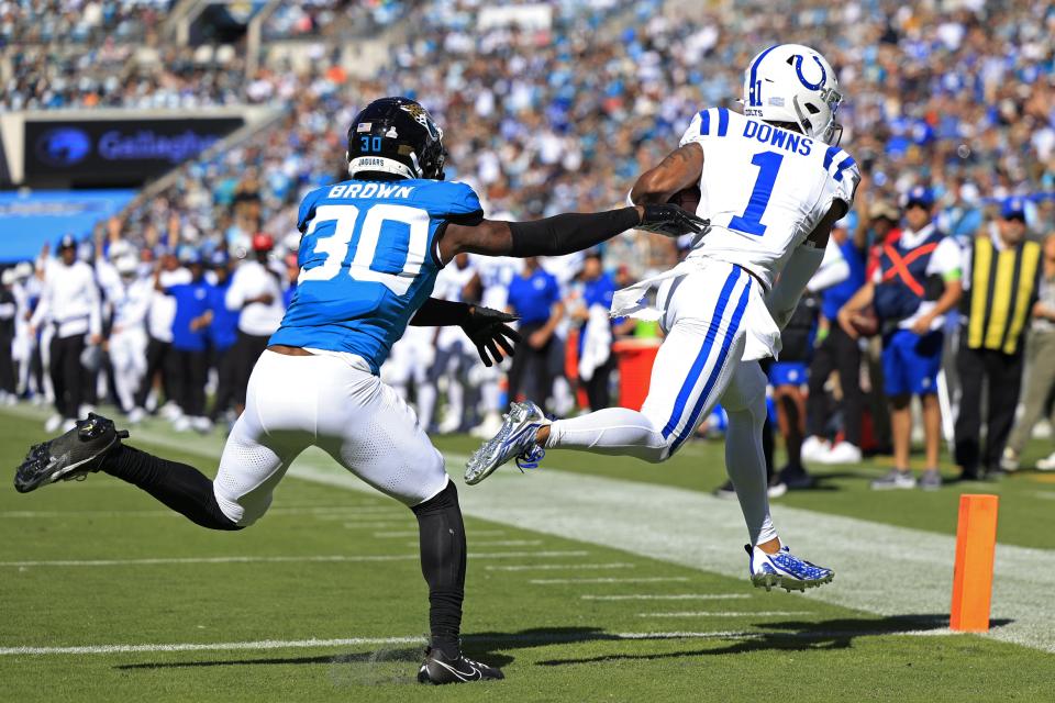 Indianapolis Colts wide receiver Josh Downs (1) scores a touchdown against Jacksonville Jaguars cornerback Montaric Brown (30) during the fourth quarter of an NFL football matchup Sunday, Oct. 15, 2023 at EverBank Stadium in Jacksonville, Fla. The Jacksonville Jaguars defeated the Indianapolis Colts 37-20. [Corey Perrine/Florida Times-Union]