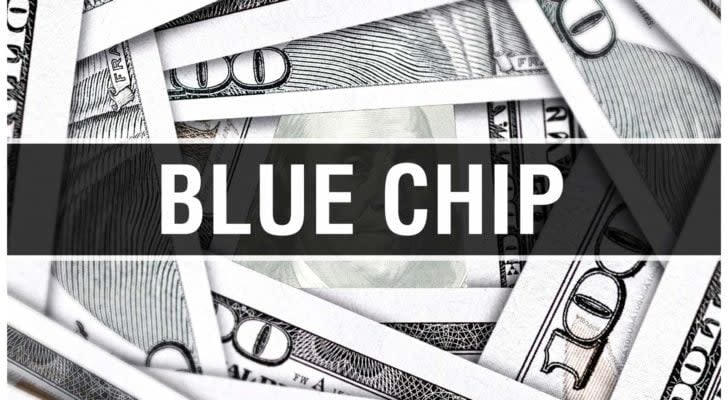 the words &quot;blue chip&quot; in bold font overtop of a pile of cash. Blue-chip stocks