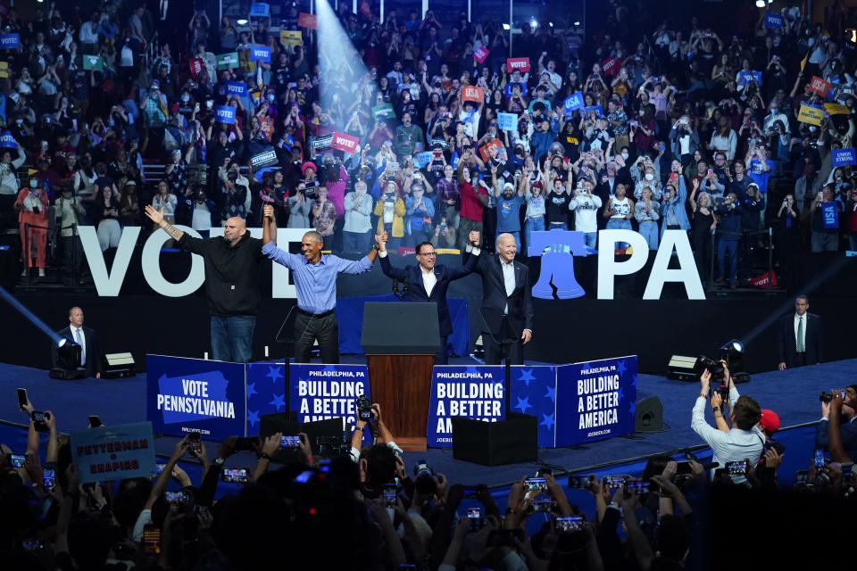 President Biden, right, and former President Barack Obama, center left, take part in a campaign rally for Shapiro, center right, and John Fetterman on Saturday in Philadelphia.