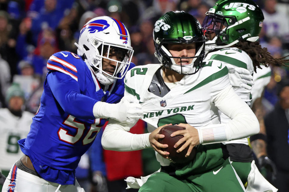 New York Jets quarterback Zach Wilson (2) is sacked by Buffalo Bills defensive end Leonard Floyd (56) during the first half of an NFL football game in Orchard Park, N.Y., Sunday, Nov. 19, 2023. (AP Photo/Jeffrey T. Barnes )