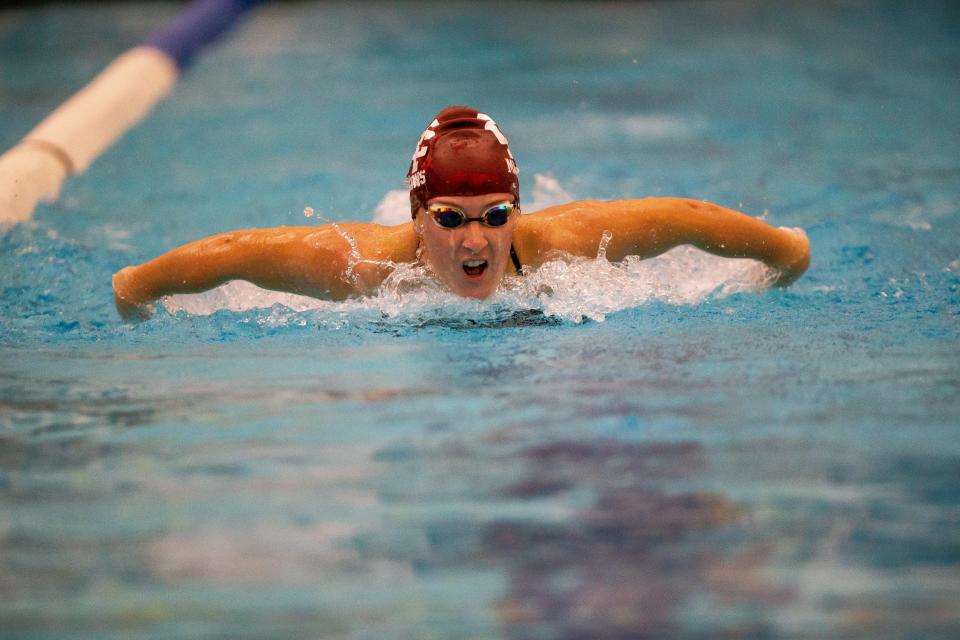 Holland Christian's Ruthie Ryden swims down the lane in the 100-yard butterfly Thursday, Sept. 21, 2023, at Zeeland West.