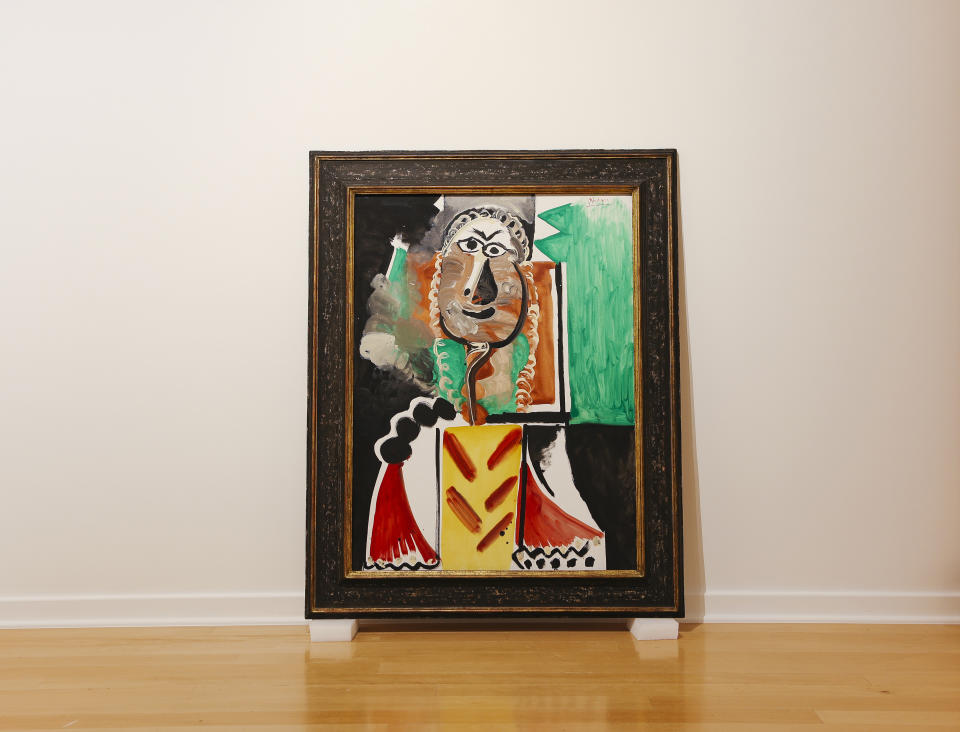 Pablo Picasso's "Buste d'Homme" painting is seen at the Bellagio Gallery of Fine Art Tuesday, Oct. 19, 2021 in Las Vegas. The artworks — nine are paintings and two are ceramic pieces — are part of MGM Resorts' collection and will be offered at auction Saturday. (Wade Vandervort/Las Vegas Sun via AP)