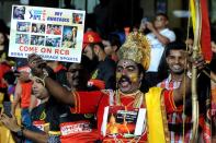 <p>A cricket fan dressed as Hindu God Rama, cheers for his team prior to the start of the final Twenty20 cricket match of the 2016 Indian Premier League (IPL) between Royal Challengers Bangalore and Sunrisers Hyderabad at The M. Chinnaswamy Stadium in Bangalore on May 29, 2016. </p>