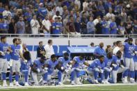 Sep 24, 2017; Detroit, MI, USA; Detroit Lions linebacker Jalen Reeves-Maybin (44) middle linebacker Tahir Whitehead (59) running back Ameer Abdullah (21) outside linebacker Steve Longa (54) defensive end Jeremiah Ledbetter (98) defensive end Armonty Bryant (97) defensive tackle A'Shawn Robinson (91) and defensive end Cornelius Washington (90) kneel during the national anthem before the game against the Atlanta Falcons at Ford Field. Mandatory Credit: Raj Mehta-USA TODAY Sports