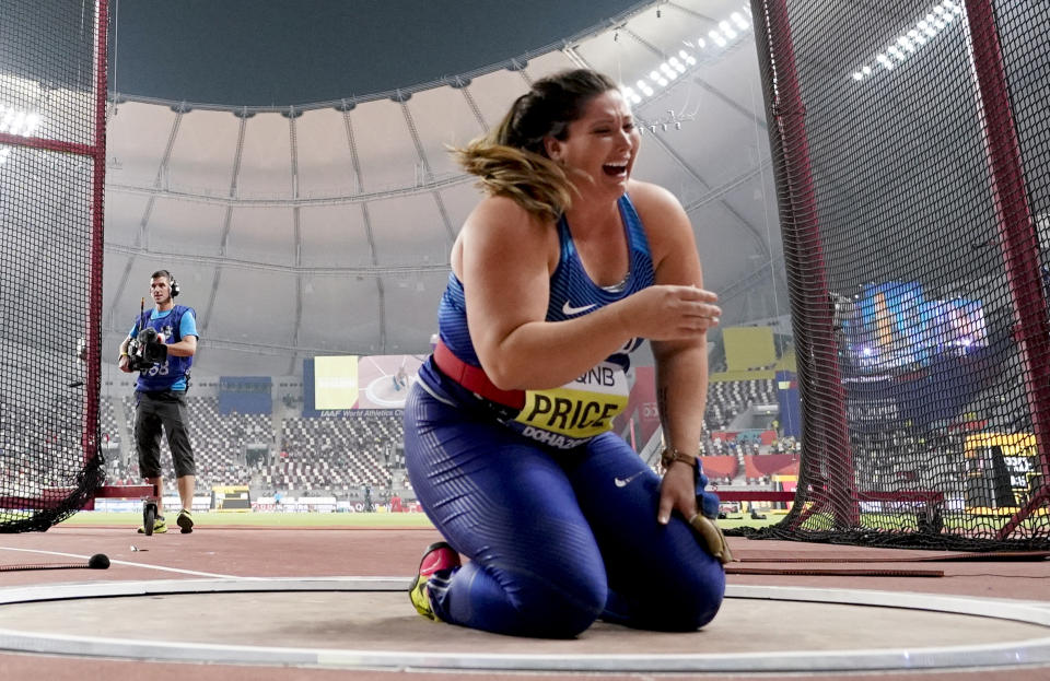 Deanna Price, of the United States, celebrates winning the gold medal for the women's hammer throw at the World Athletics Championships in Doha, Qatar, Saturday, Sept. 28, 2019. (AP Photo/David J. Phillip)