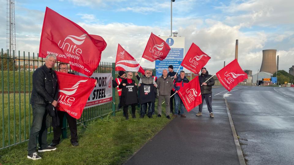 Union members stand on a picket line at the Scunthorpe steel works