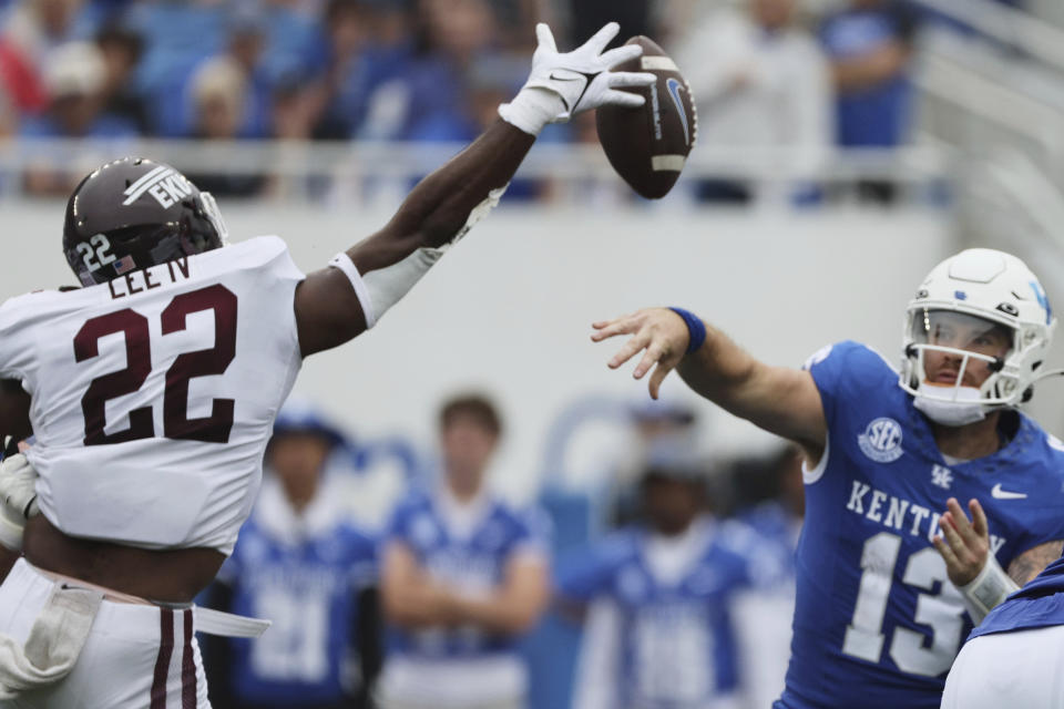 Eastern Kentucky linebacker Frank Lee (22) tips a pass from Kentucky quarterback Devin Leary (13) during the first half of an NCAA college football game in Lexington, Ky., Saturday, Sept. 9, 2023. (AP Photo/Michelle Haas Hutchins)