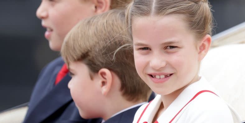 prince george of wales, prince louis of wales and princess charlotte of wales travel in a carriage together and wave to crowds during trooping the colour