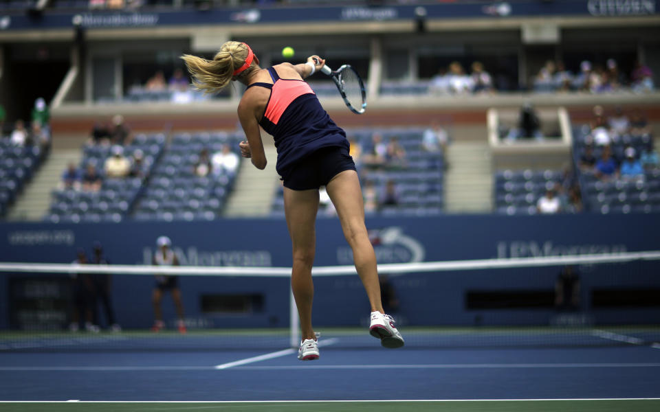 Agnieszka Radwanska, of Poland, serves to Spain's Silvia Soler-Espinosa in the first round of the 2013 U.S. Open tennis tournament, Monday, Aug. 26, 2013, in New York. (AP Photo/David Goldman)