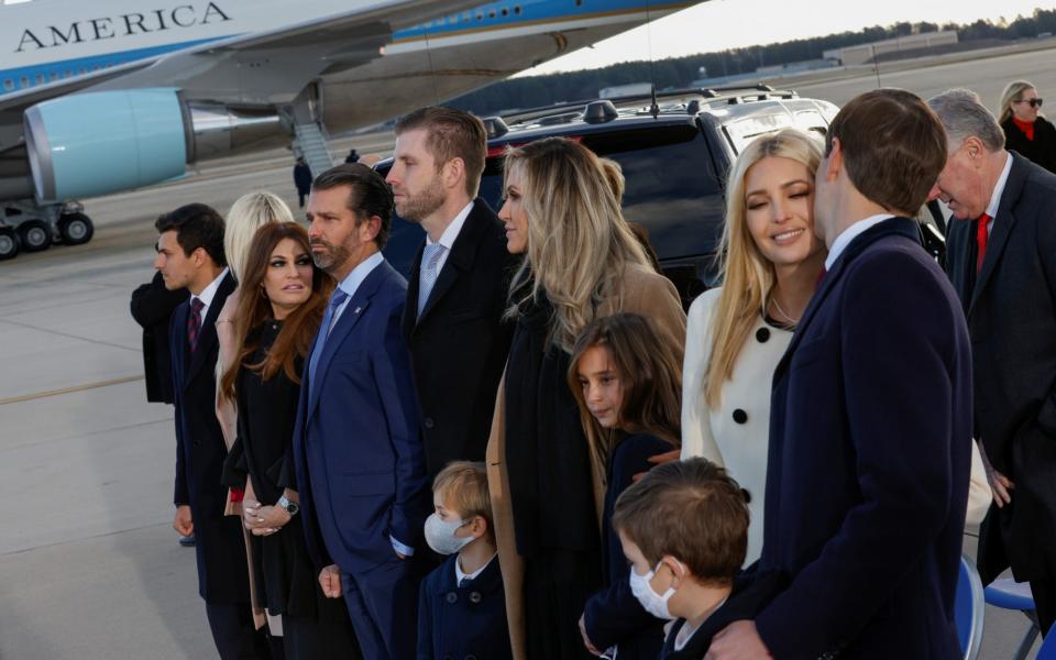 The president's family gathered at Joint Base Andrews for the ceremony - Reuters