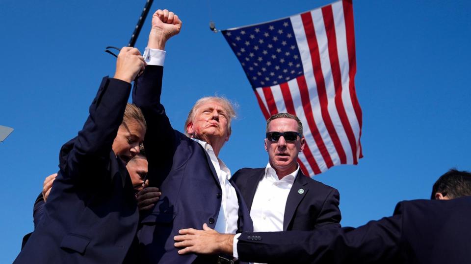 PHOTO: Republican presidential candidate former President Donald Trump is surrounded by U.S. Secret Service agents at a campaign rally, July 13, 2024, in Butler, Pa. (Evan Vucci/AP)